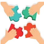 Four hands assembling red and green puzzle pieces